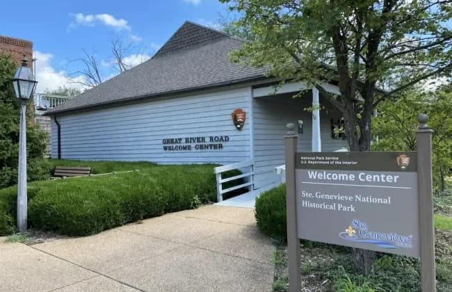 A welcome center for Ste. Genevieve National Historical Park, featuring a modern building and landscaped surroundings.